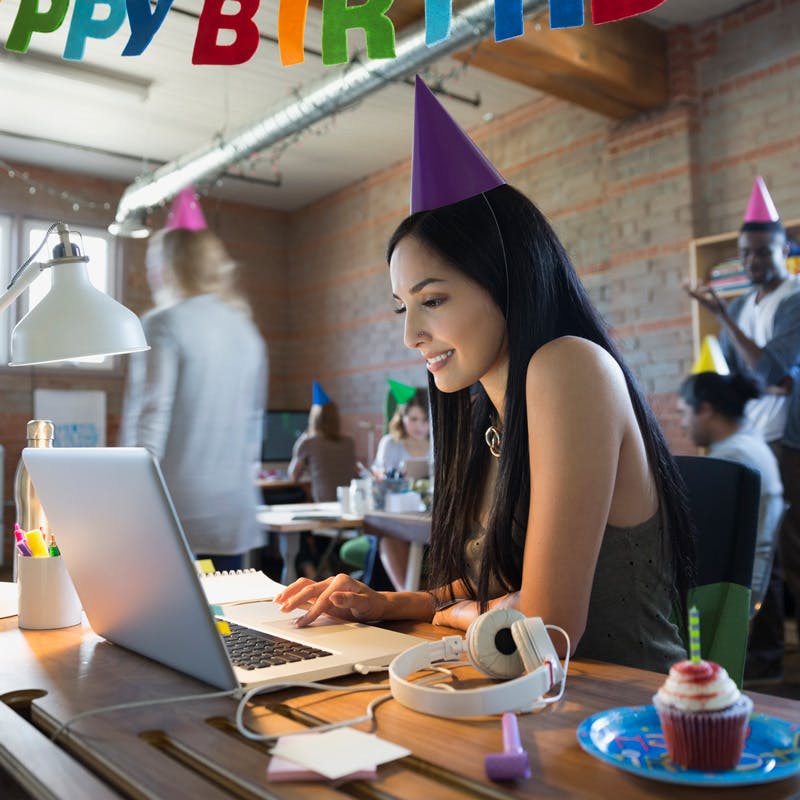 Girl at desk with computer celebrating her birthday