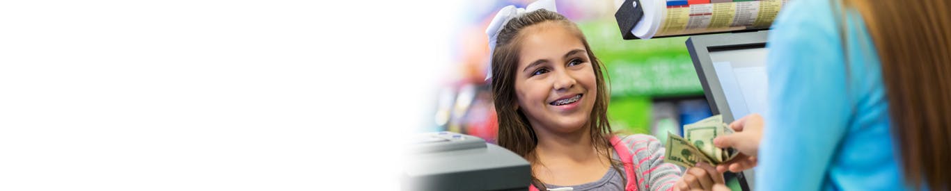 Little girl making cash payment - digital economy
