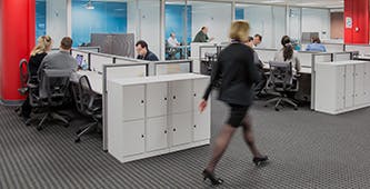 woman walking through an office