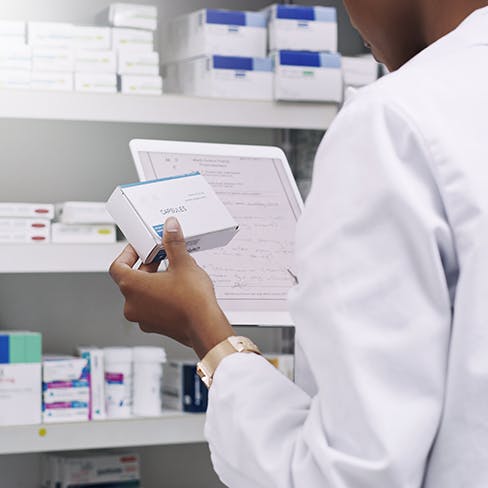pharmacist filling a prescription