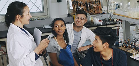 instructor and students in a chemistry class