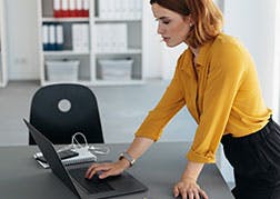 woman working remotely on laptop