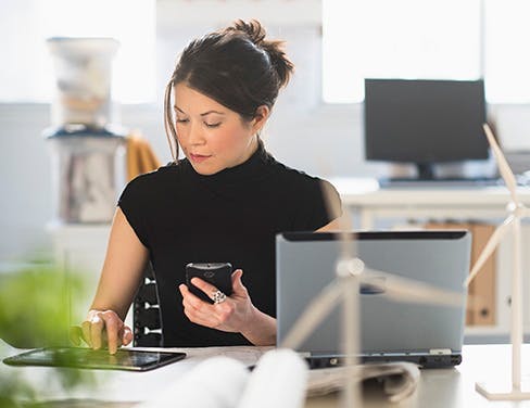 woman working on mobile device