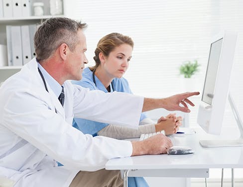 Two-doctors-at-computer-training