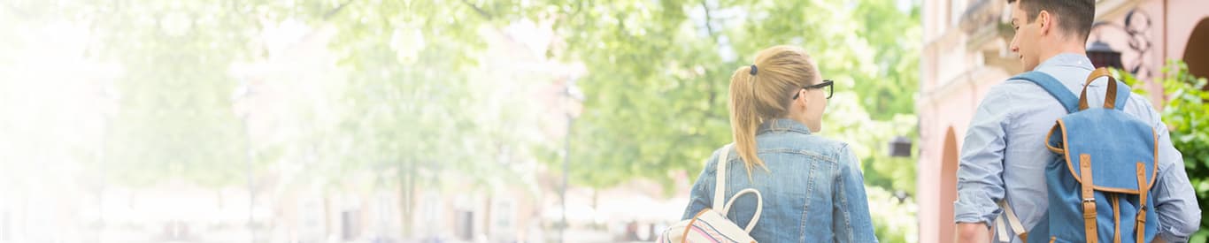 Students walking to class with backpacks