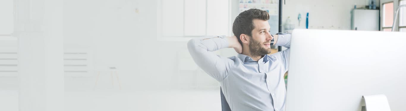 businessman behind computer