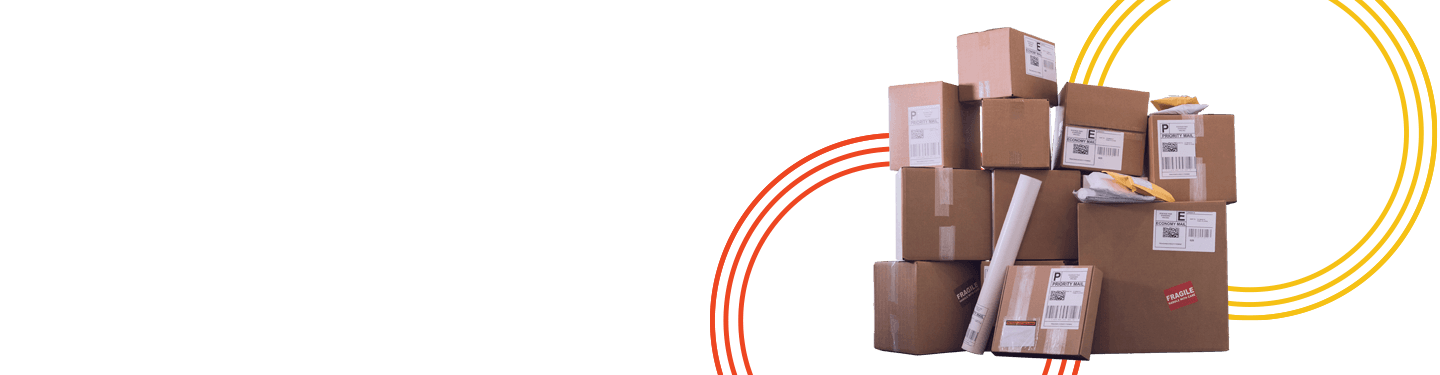 A large stack of cardboard boxes, with barcodes on envelopes and a cylinder are sitting inside a door of an office