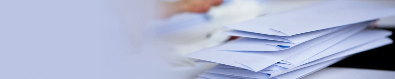 Stack of envelopes for Return mail sender webinar article