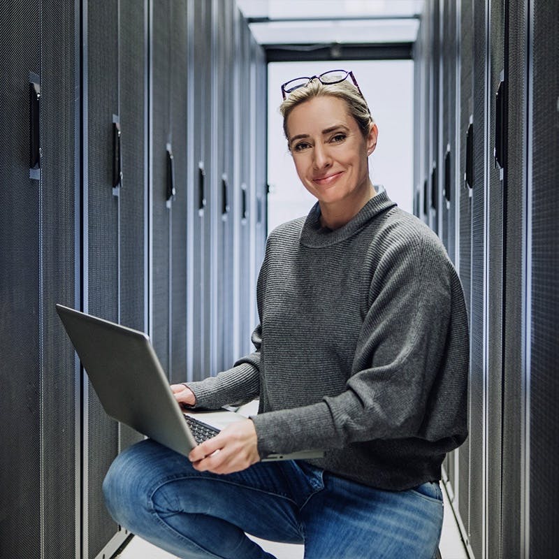 Woman working in a server room