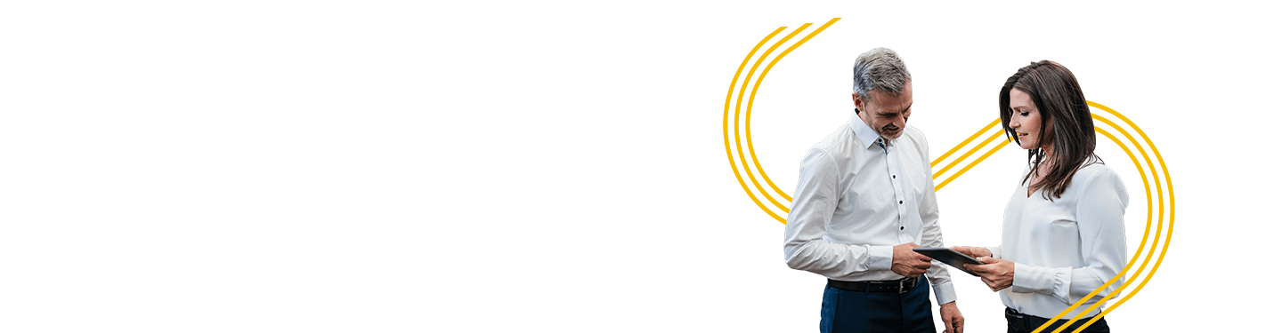 Coworkers talking over a tablet