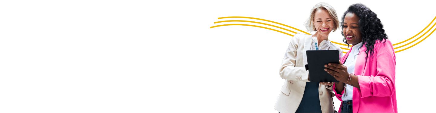 two women working on a tablet together