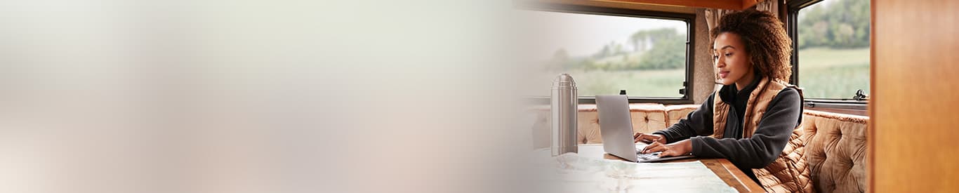 Woman working from a remote location on her laptop