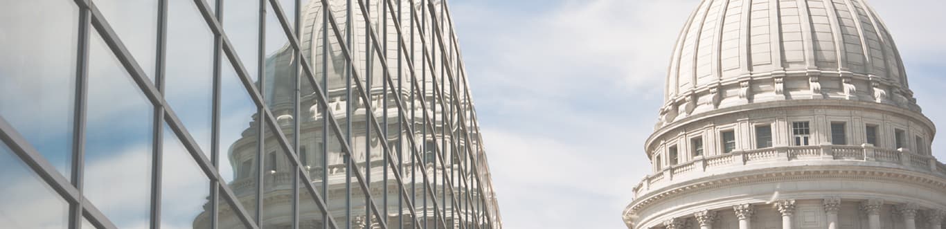 Ricoh capitol building in background with windows of skyline front view