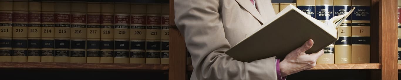 Woman reading library reference book