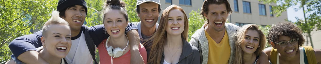 group of smiling happy college students