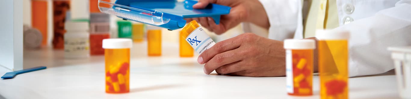 Pharmacist filling prescription