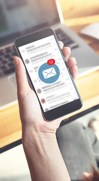 woman reviewing digital mail on her mobile phone