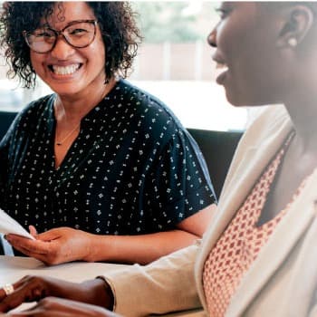 Three people in a business meeting