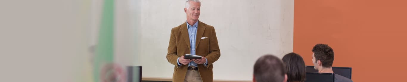 Teacher giving lessons to students