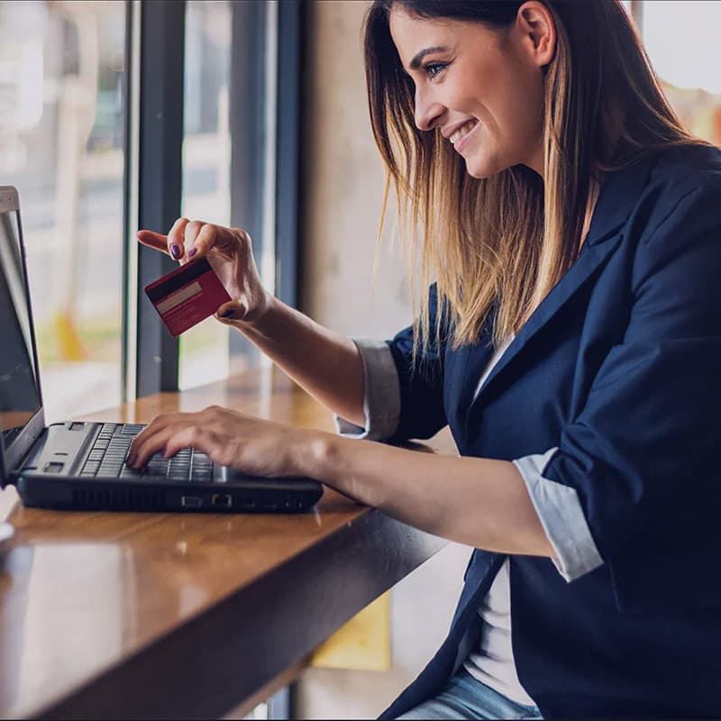 Woman making payment on laptop