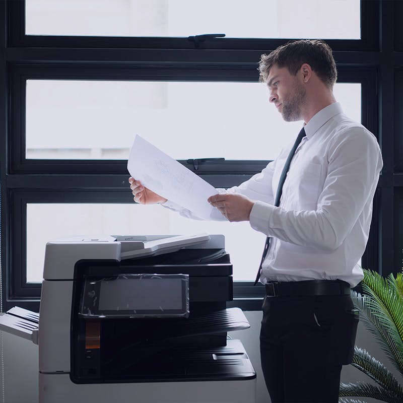 Businessman in office working with fax workflow