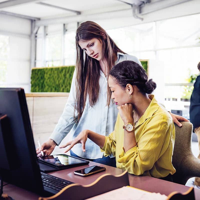 A modern Office Space With Employees Working At Desks