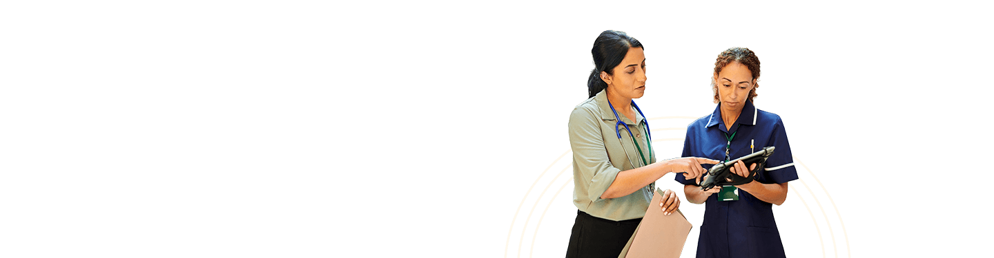 Two healthcare professionals with a file and tablet in a discussion demonstrating how order & referral management delivers patient care more efficiently and securely.