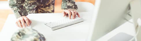 military person using computer