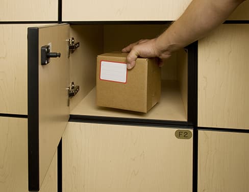 Hand grabbing a mailed package.