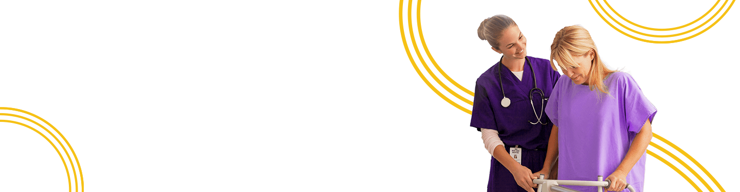 Nurse helping a patient walk with a walker