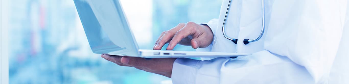 Doctor holding a laptop