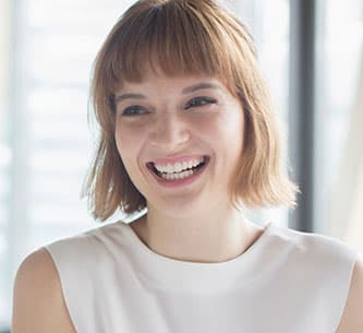 smiling woman greeting visitor